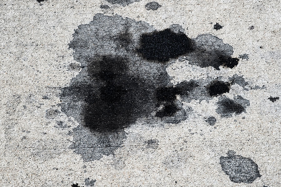 A grease stain on the concrete in the garage of a Kansas City, MO home.