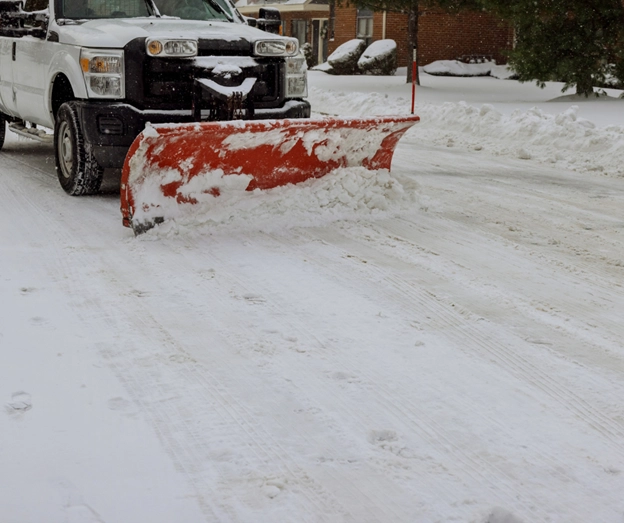 This is a photo of a road being plowed in Liberty, MO by Royal Blue Power Washing of Kansas City, MO.